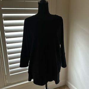 Longer top? Details in front, back, on sleeves,  split on sides.